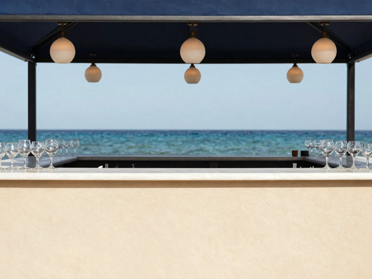 Candid editorial detail of a bar counter with polished glassware